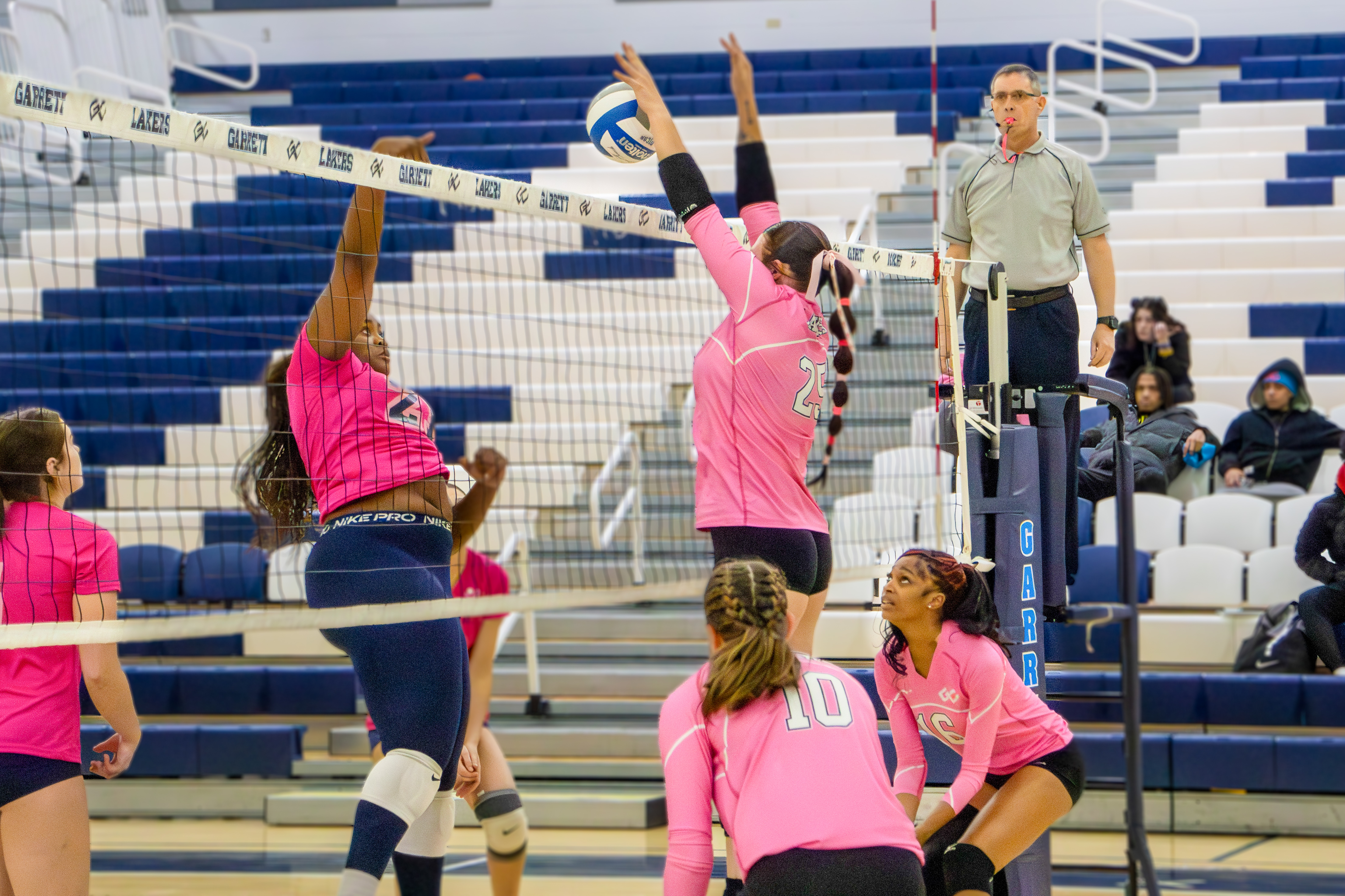 Garrett College’s Brenna L’Hommedieu (25) blocks a kill attempt Brenna L'Hommedieu